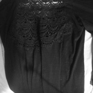 Quarter sleeve shirt with lace backing.